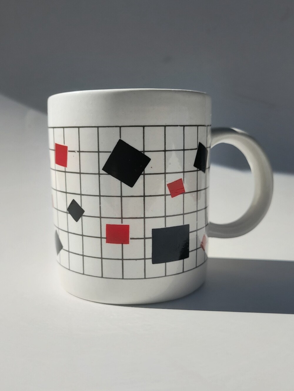 Vintage White Ceramic Mug with Black and Red Geometric Grid Pattern